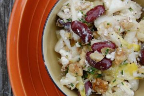 cauliflower kidney bean and feta salad on an orange plate