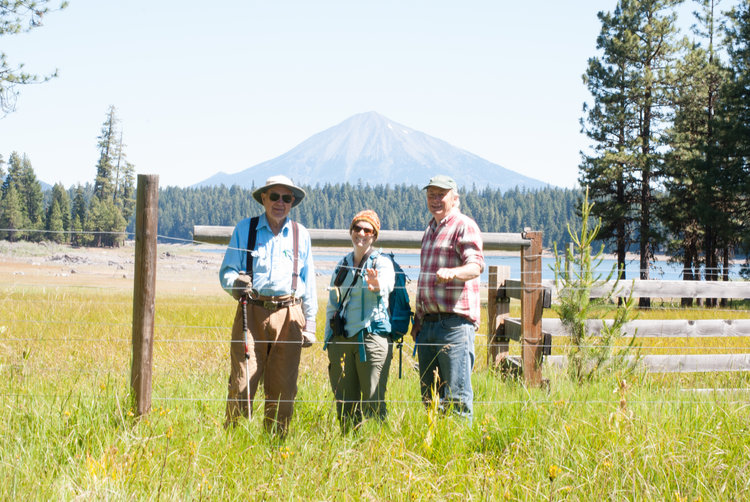Landowner Jud Parsons, SOLC's Karen Hussey, and forester Marty Main pictured with Mt. McLoughlin in the background.
